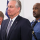 Missouri Gov. Jay Nixon (center) stands with St. Louis Chief of Police Sam Dotson (left) and Missouri Highway Patrol Capt. Ron Johnson during a press conference Nov. 11, 2014, to discuss law-enforcement preparations for the announcement of the grand jury's decision regarding Ferguson, Mo., police Officer Darren Wilson.
Scott Olson/Getty Images